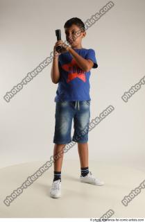 TIMBO STANDING POSE WITH GUN